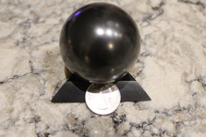 Unpolished 7 cm sphere on polished slab