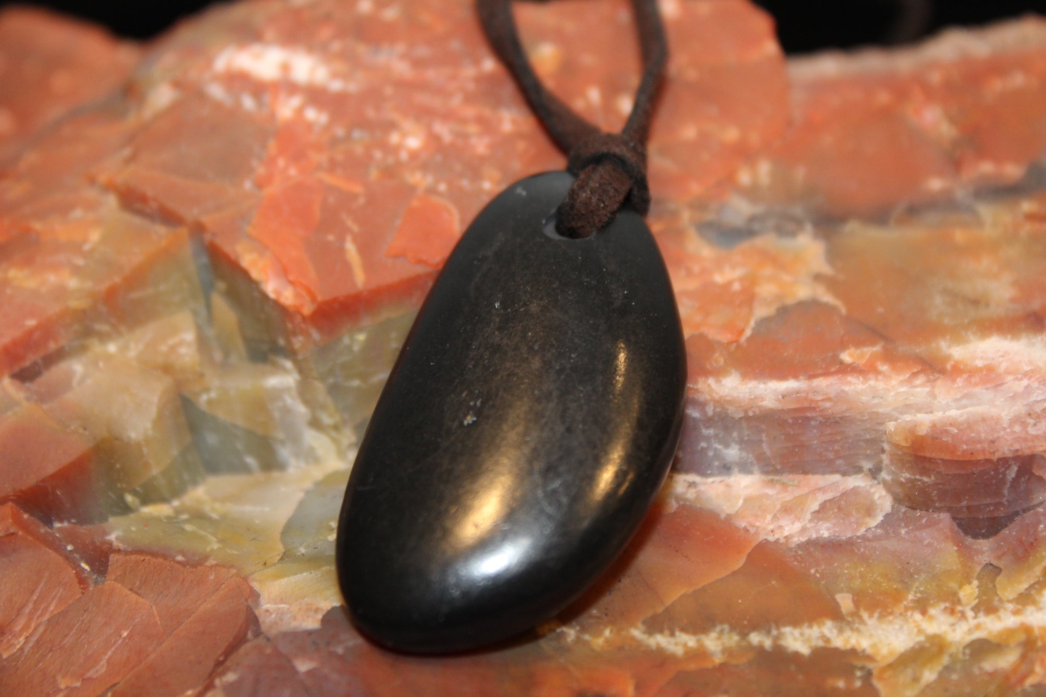 POLISHED PEBBLE SHUNGITE NECKLACE ON SUEDE LEATHER CORD